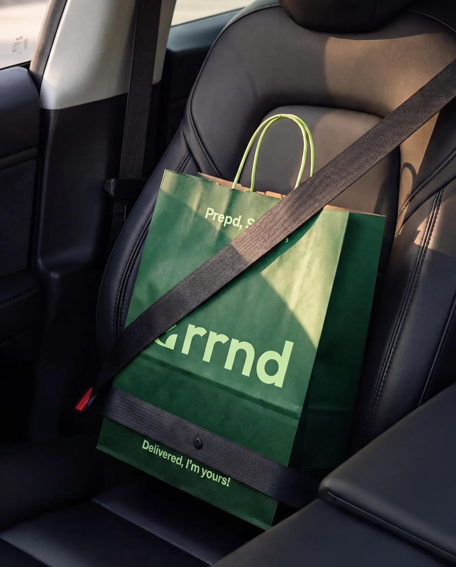 An Errnd bag buckled into a car seat